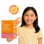 Child holding a single Purest Kids omega-3 burstlet with product box — kid-approved, 100% plant-based and vegan